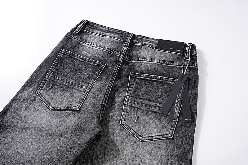 AMIRI Washed Black Distressed Jeans — detail
